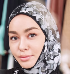 smiling-young-woman-making-sketches-of-islamic-fas-2022-03-25-18-55-43-utc-Cropped.jpg
